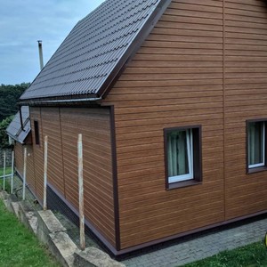 Отделка фасада панелями Vox Max 3 дуб золотой 150 м²