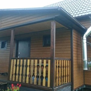 Отделка фасада сайдингом Vox Max-3 дуб золотой 120 м²