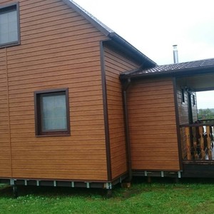 Отделка фасада сайдингом Vox Max-3 дуб золотой 120 м²
