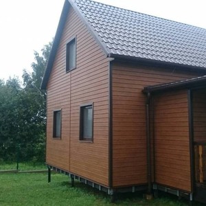 Отделка фасада сайдингом Vox Max-3 дуб золотой 120 м²