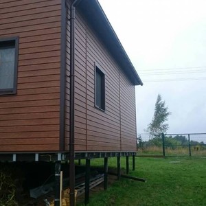 Отделка фасада сайдингом Vox Max-3 дуб золотой 120 м²