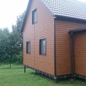 Отделка фасада сайдингом Vox Max-3 дуб золотой 120 м²