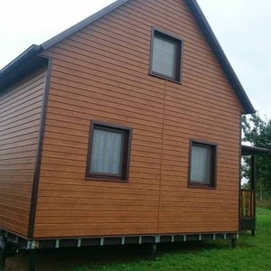 Отделка фасада сайдингом Vox Max-3 дуб золотой 120 м²