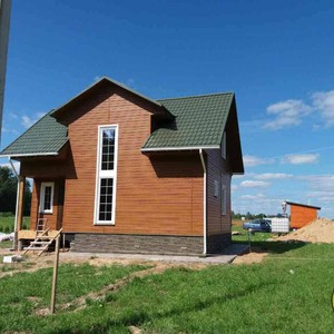 Отделка фасада сайдингом Vox Max 3 дуб золотой 140 м²