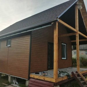 Отделка фасада сайдингом Vox Max 3 дуб золотой 80 м²