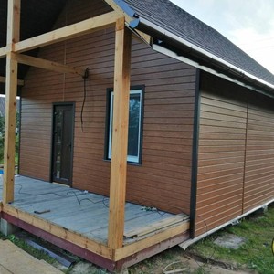 Отделка фасада сайдингом Vox Max 3 дуб золотой 80 м²